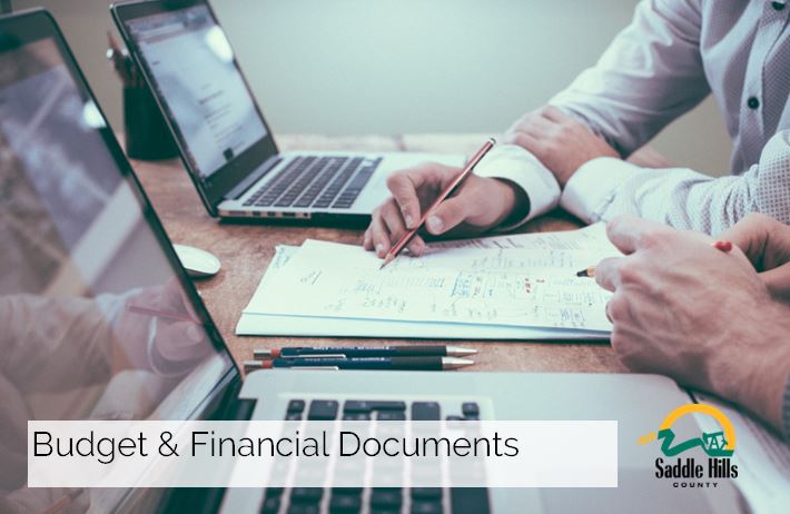Image of hands working on financial documents