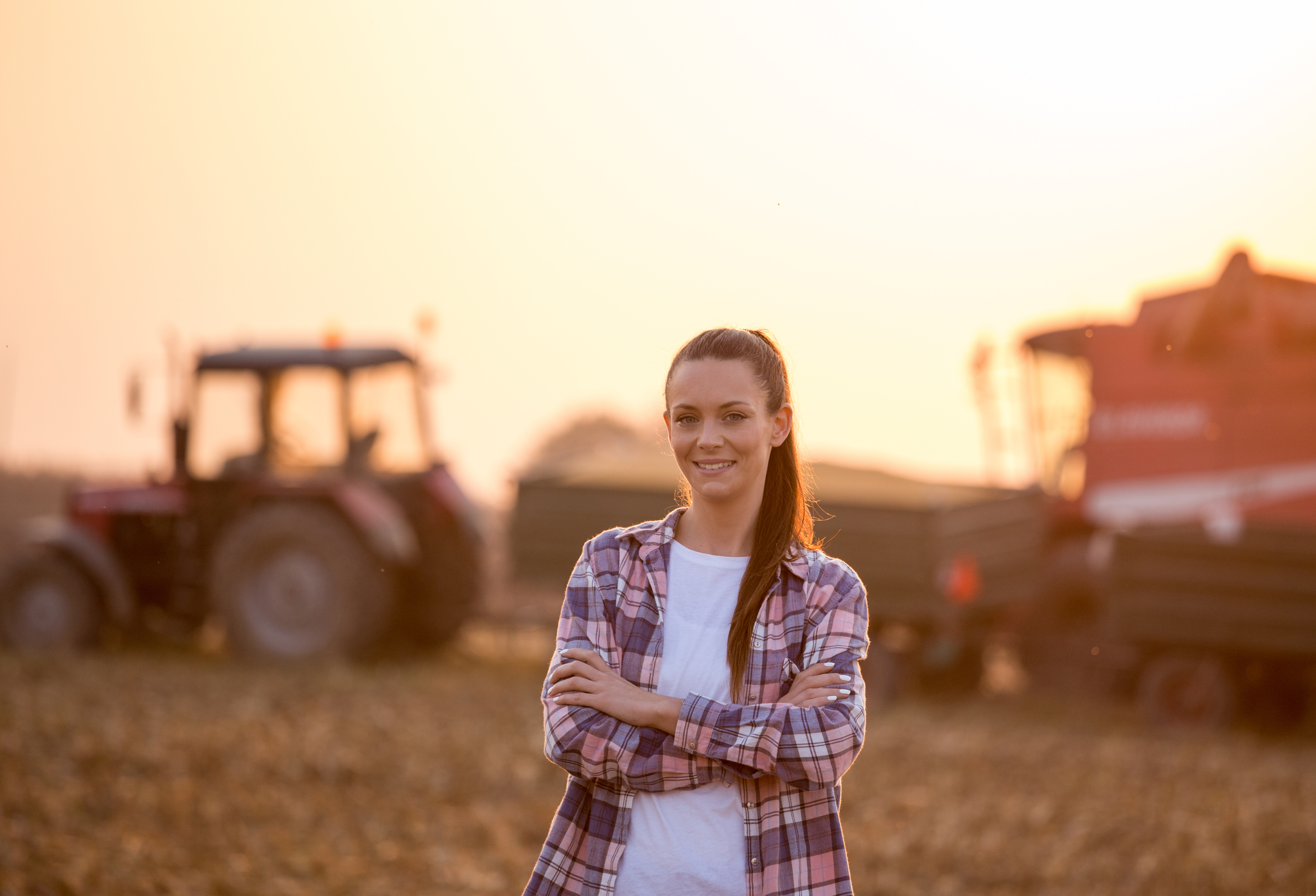 Woman in front of Farm Equipment