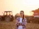 Woman in front of Farm Equipment