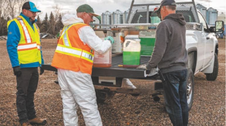 Image of Proper Disposal of Pesticides off back of pickup truck