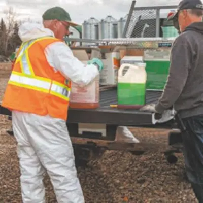 Image of Proper Disposal of Pesticides off back of pickup truck