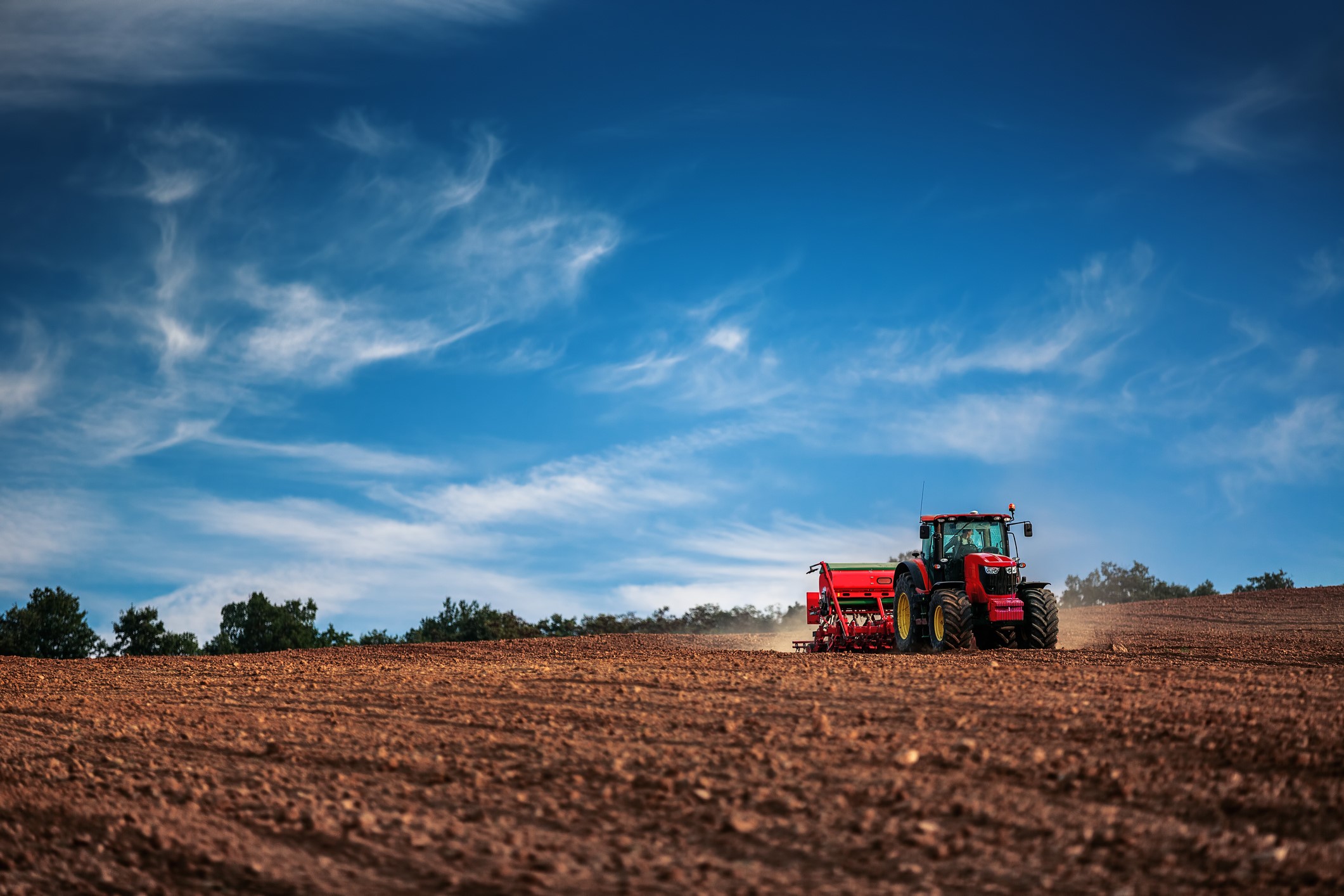 Image of tractor in field during seeding