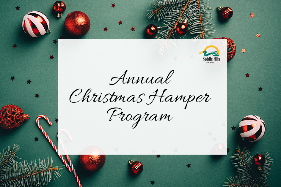 Image of Christmas decorations with text "Annual Christmas Hamper Program"
